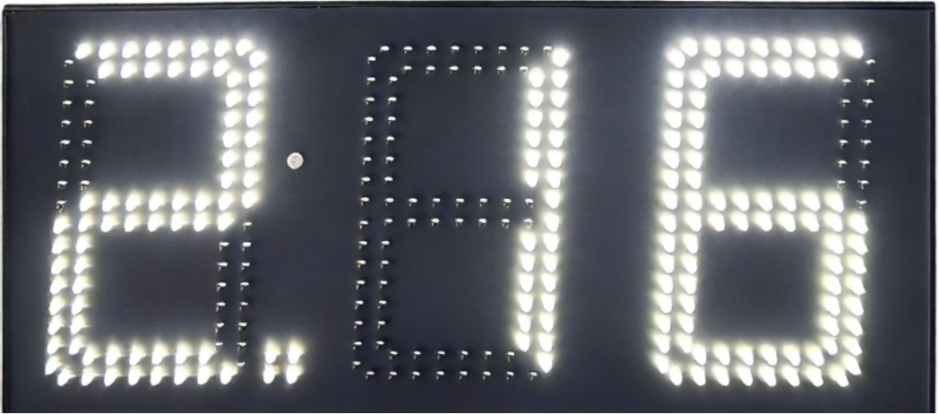 Red 6 inch LED gas price sign displaying 2.556